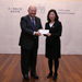 Chief Justice MA takes a picture with Ms Cheung Lai-wah, Sarah, Personal Secretary I who received the Secretary for Civil Service's Commendation Award (9 December)