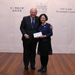 Chief Justice MA takes a picture with Mrs Hung Cao Yu-qing, Workman II who received the Secretary for Civil Service's Commendation Award (9 December)